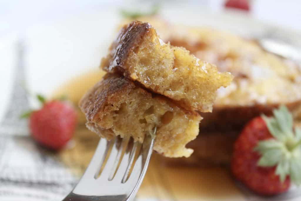 two pieces of French toast on a fork