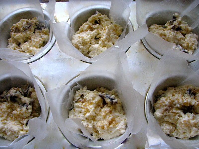 plum muffins in a muffin tin ready to bake