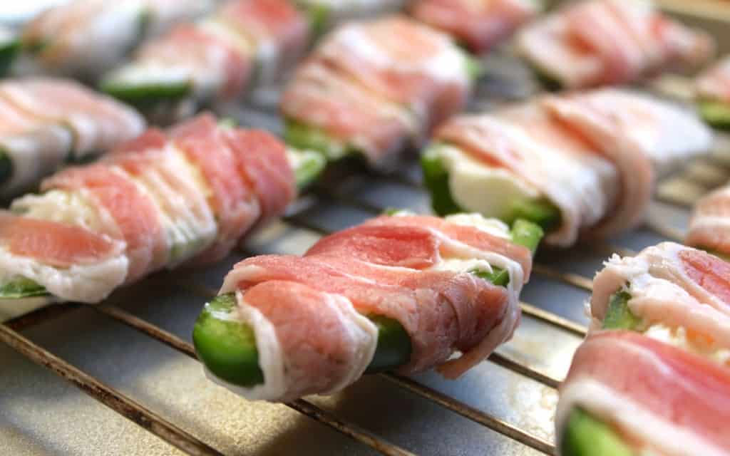 bacon Jalapeno halves filled with cream cheese and wrapped with raw bacon