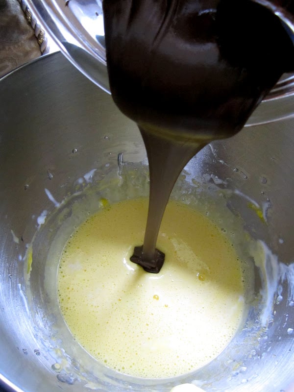 adding chocolate to egg mixture