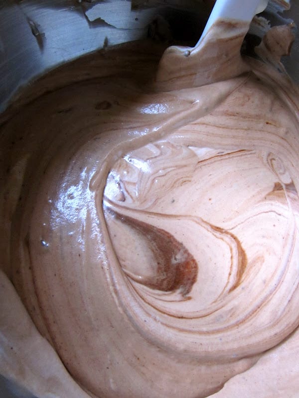 mixing mousse in a bowl with a spatula