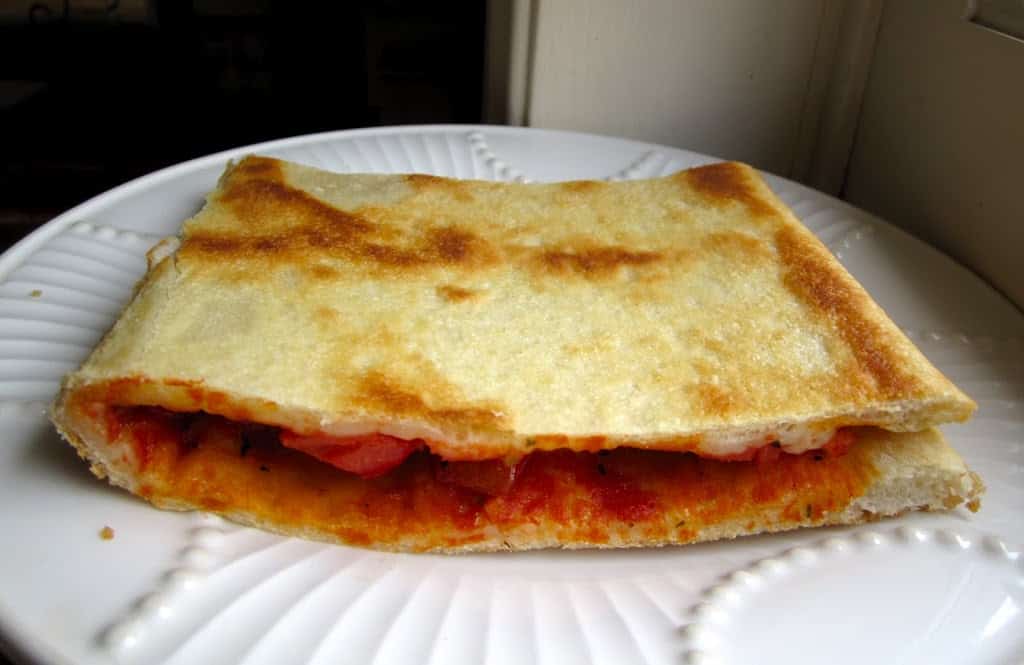folded pizza on a plate