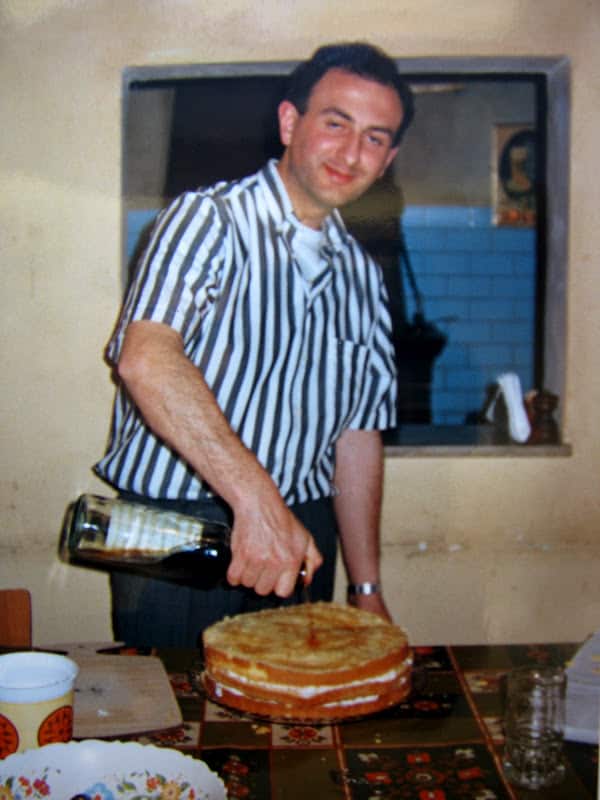 pouring cognac on cake