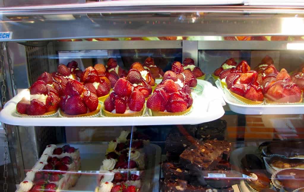bakery window with strawberry tarts in london