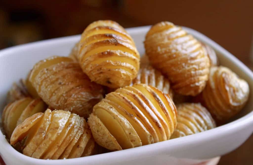 Tiny truffled hasselback potatoes finger food