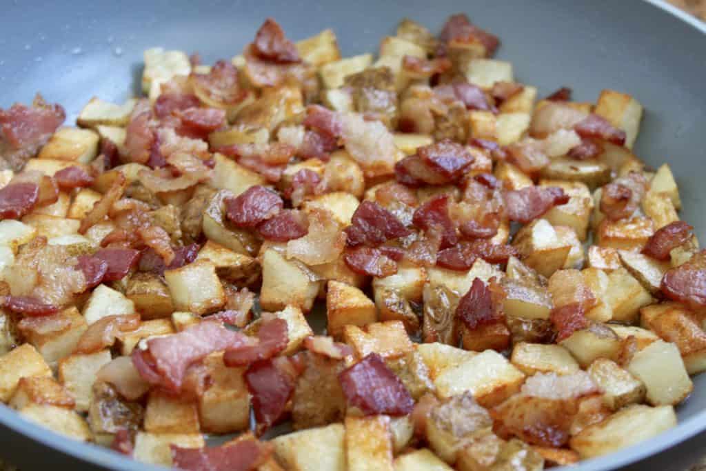 Bacon and potatoes ready for eggs in frittata