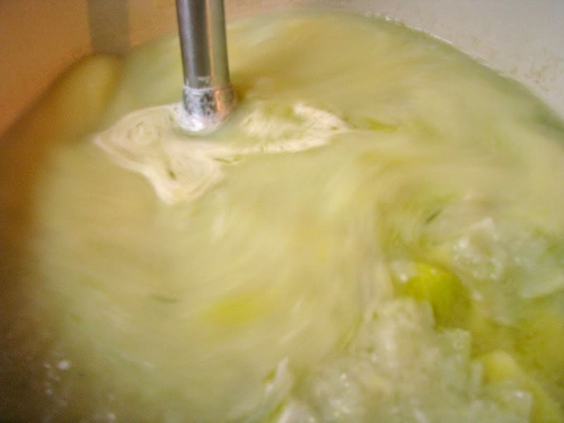 blending leek and potato soup with immersion blender