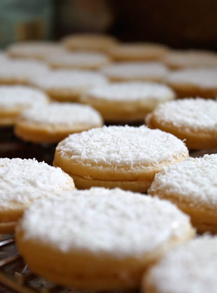 close up of snow cookies on a cooling rack