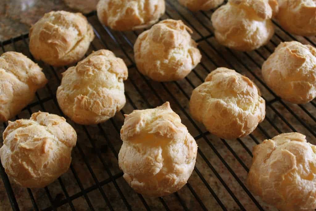 cream puffs cooling on rack