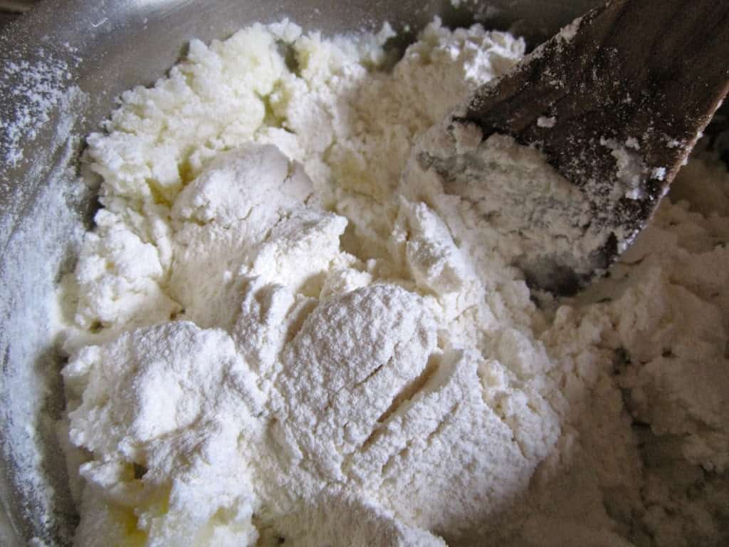 adding flour to make potato scones