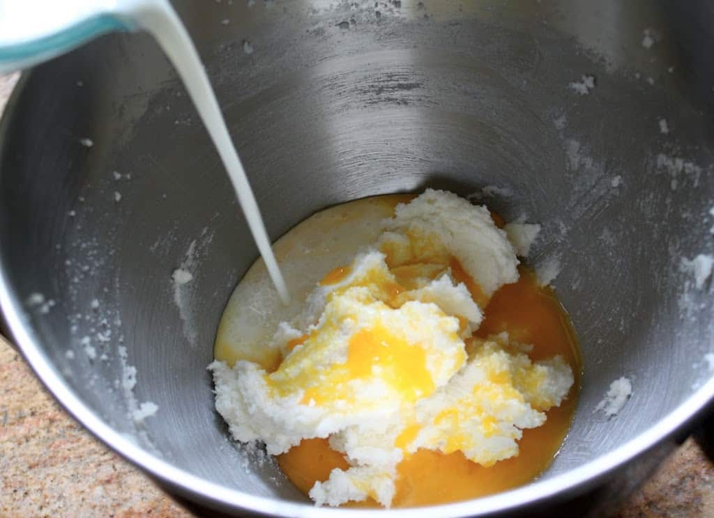 adding milk and eggs
