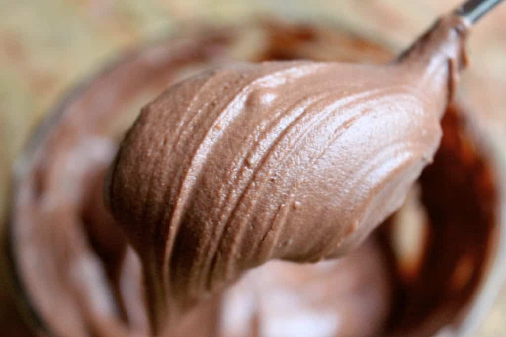 chocolate buttercream frosting on a spoon