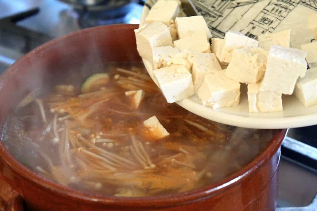 adding tofu to doenjang jjigae