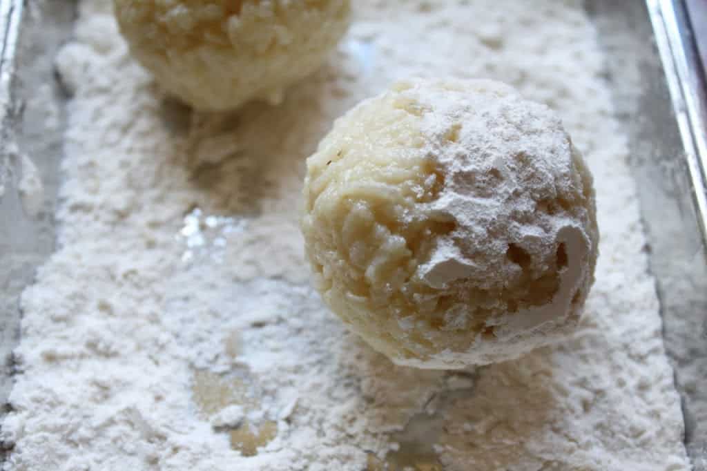 rolling arancini in flour