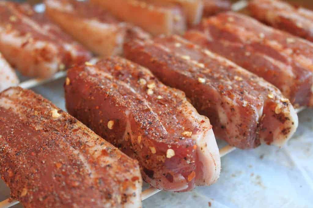 italian guanciale pork cheek on a wooden board. main ingredient