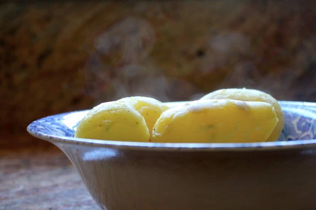 peeled boiled potatoes in a bowl