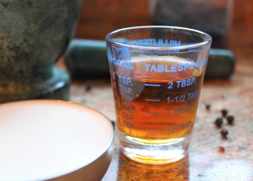 brandy for steak au poivre in a measuring glass