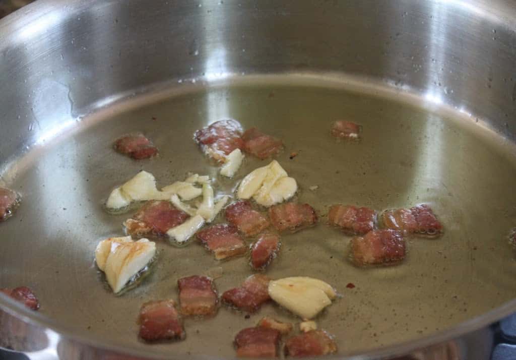 cooking garlic and pancetta for vodka sauce