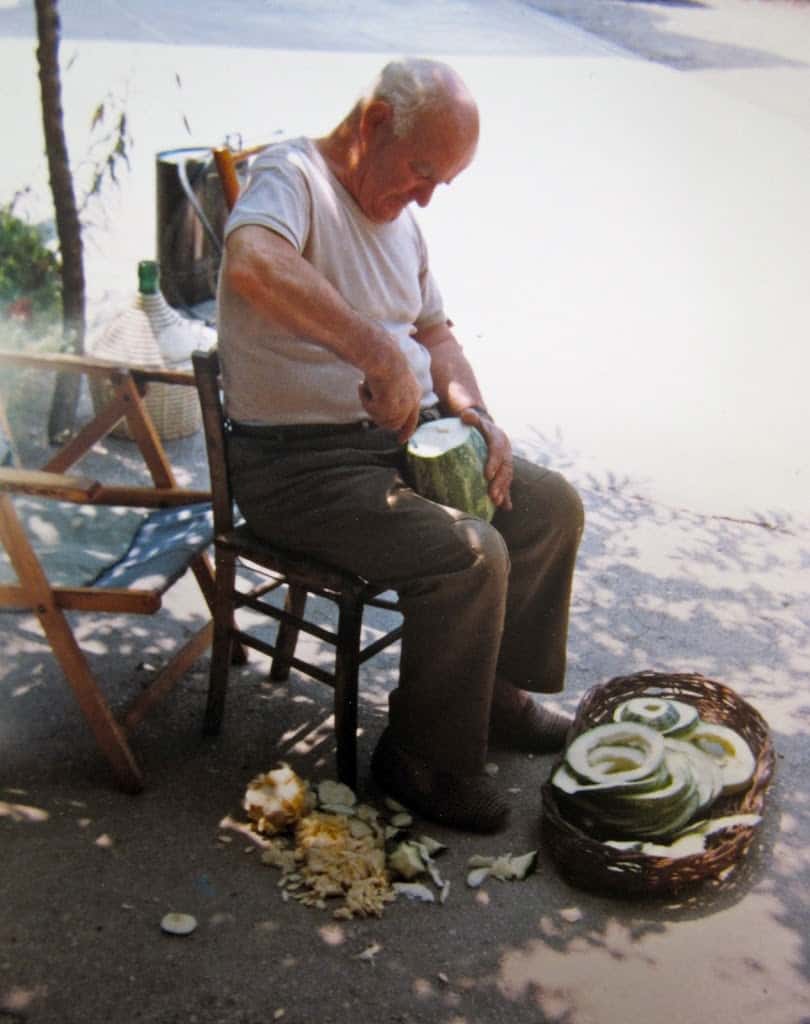 Nonno slicing zucchini to dry