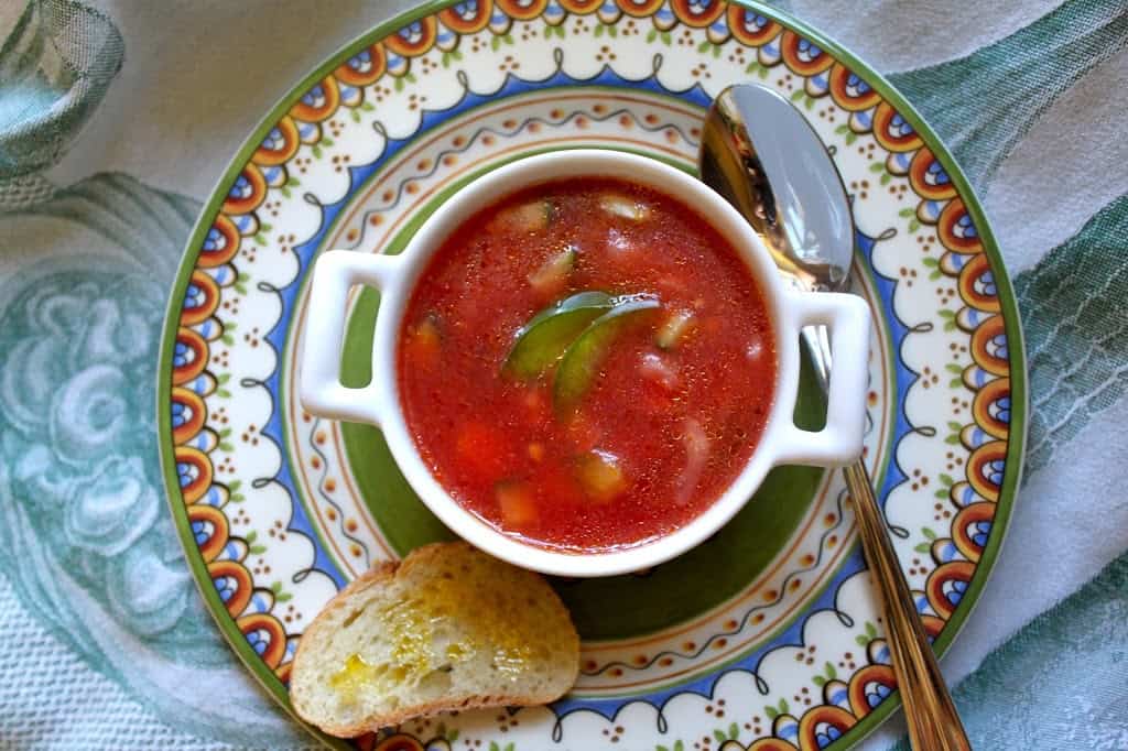 overhead shot of bowl of gazpacho with bread