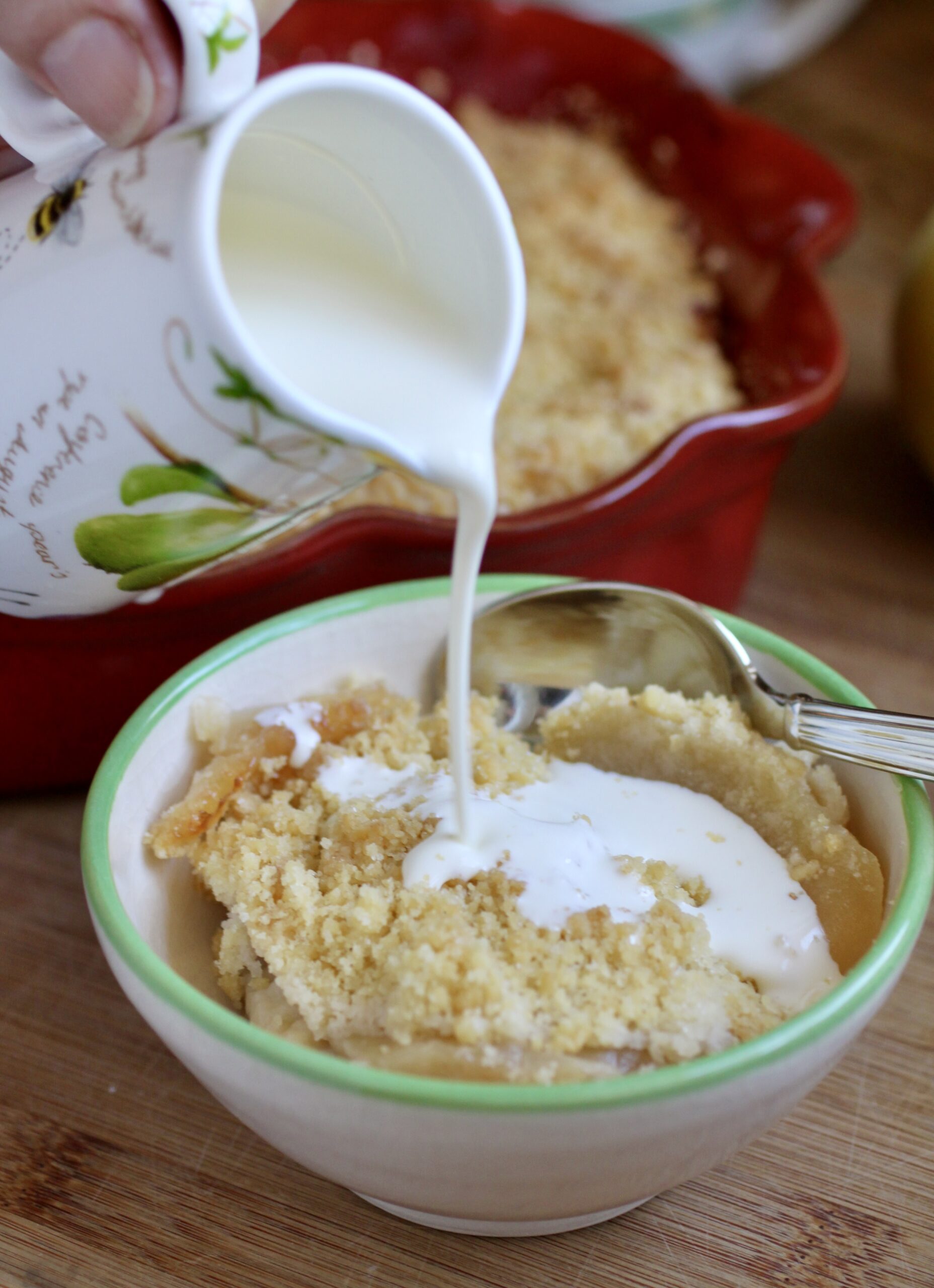 pouring cream onto dessert