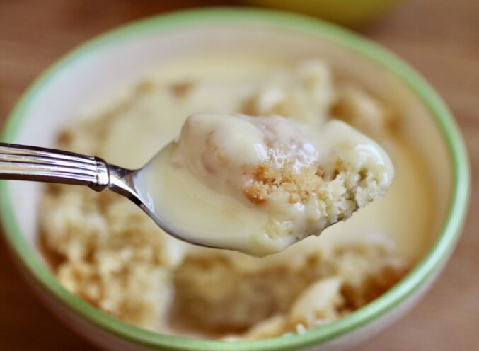 spoonful of apple crumble and custard