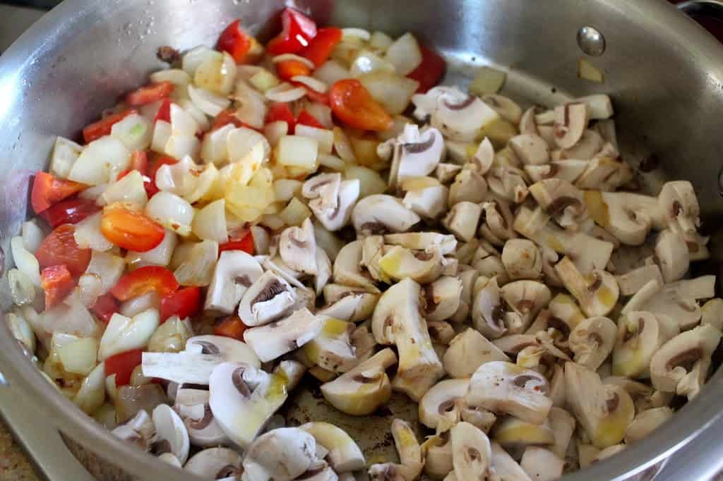 frying veg and mushrooms in pan