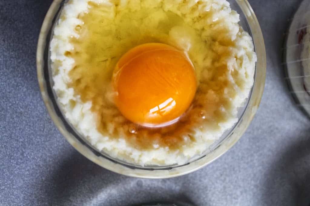 adding the raw egg