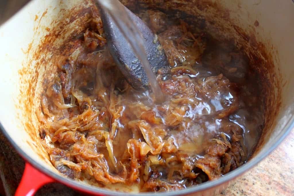 caramelized onions in a pot with alcohol