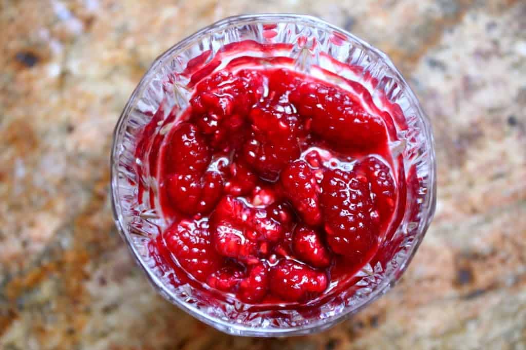 raspberries in a crystal glass