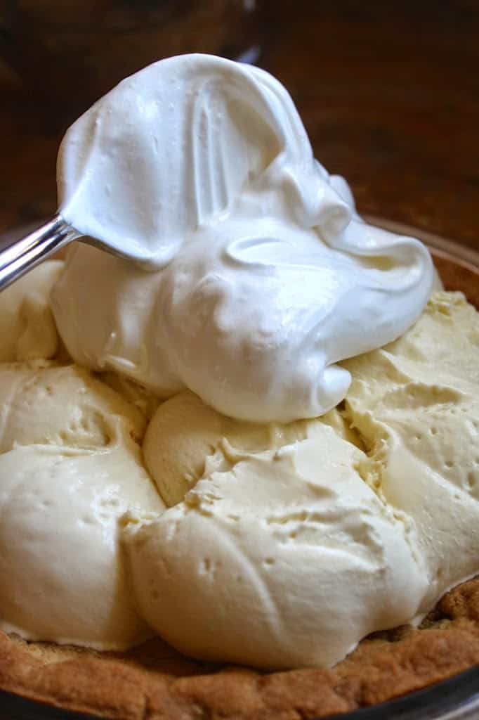 putting meringue on the ice cream for baked Alaska pie