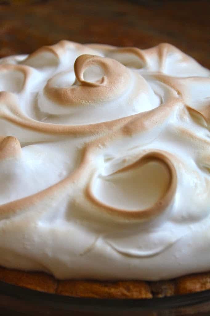 browned meringue swirls on the baked Alaska pie