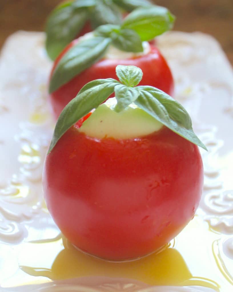tomato and burrata appetizers in a row