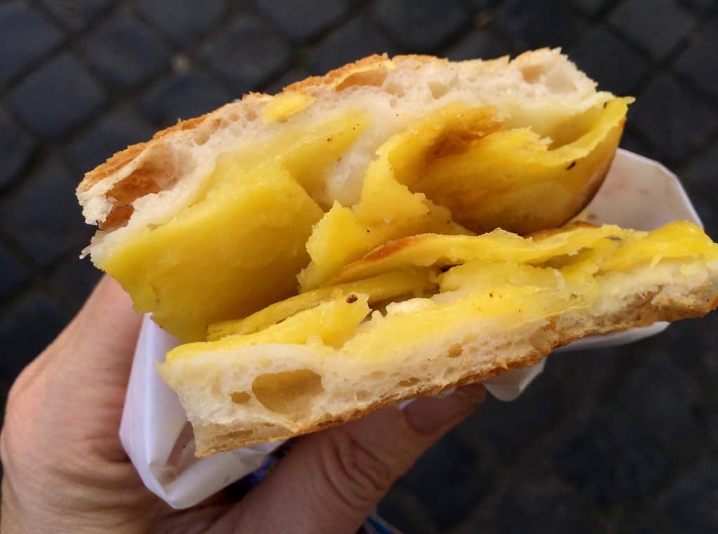 handheld potato pizza in Rome