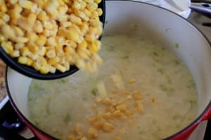 adding corn to chowder