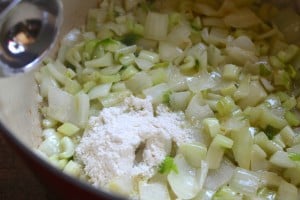 flour into celery and onions for corn chowder