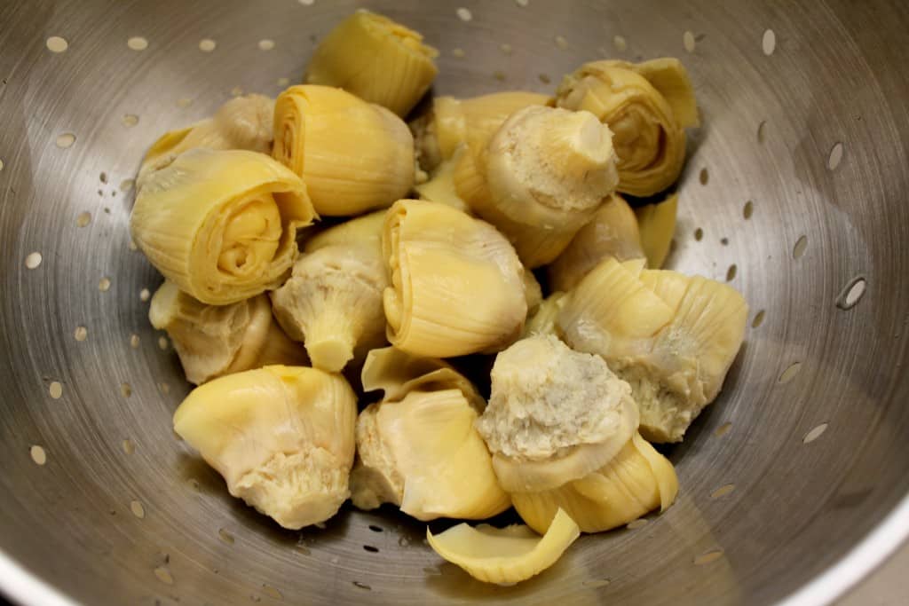 preparing artichoke hearts