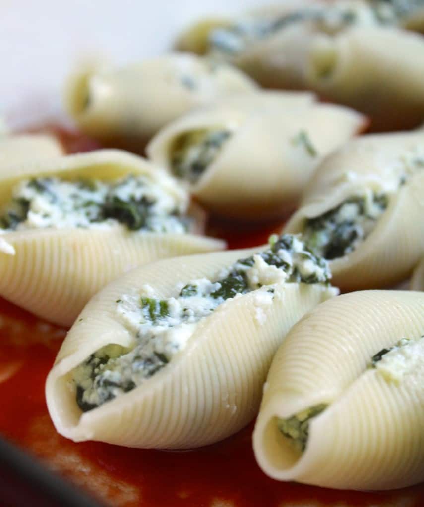 stuffed shells in a tray, ready for sauce