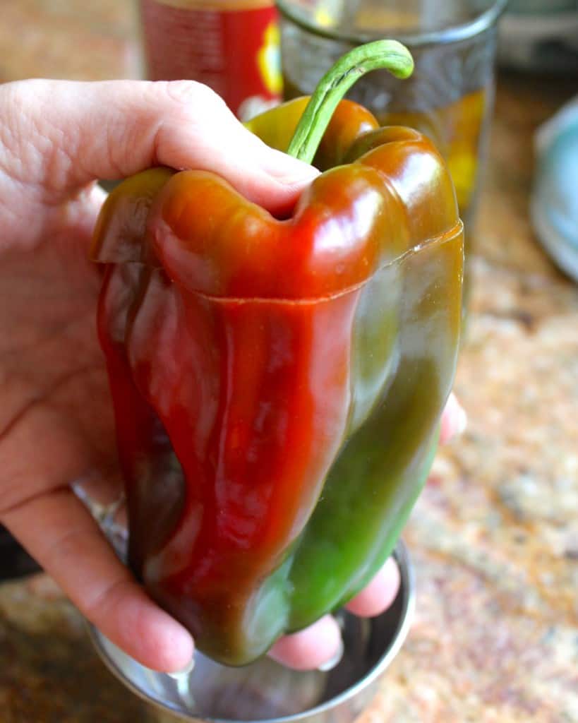 shaking a red and green bell pepper