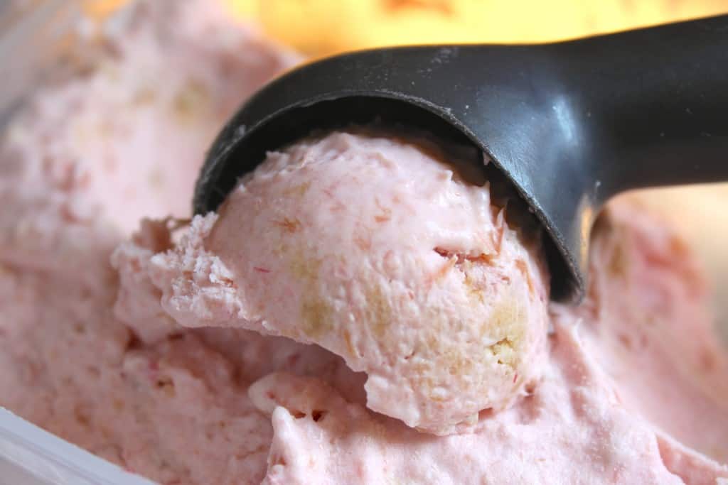 scooping rhubarb ice cream