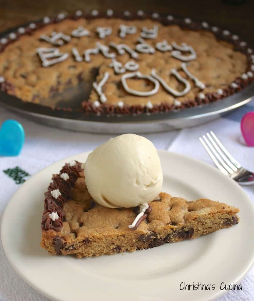 Piece of birthday chocolate chip cookie cake with ice cream