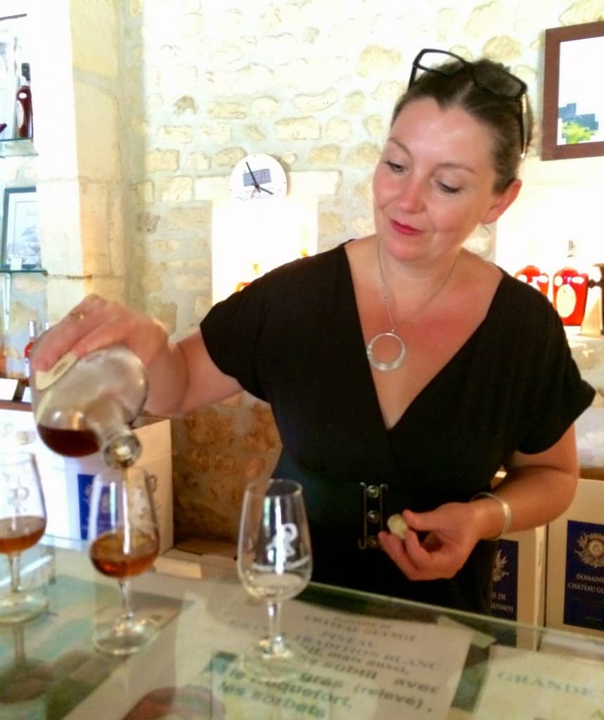pouring glass of pineau Chateau Guynot