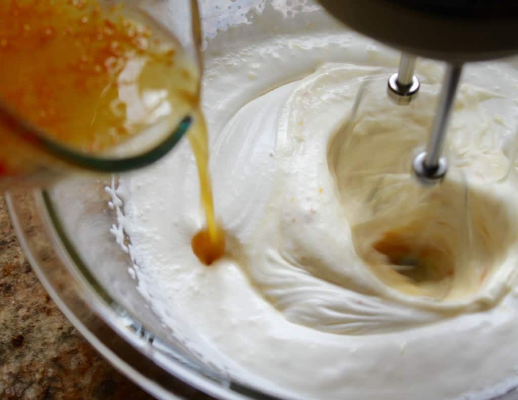 Adding juice to cream for Orange Boodle