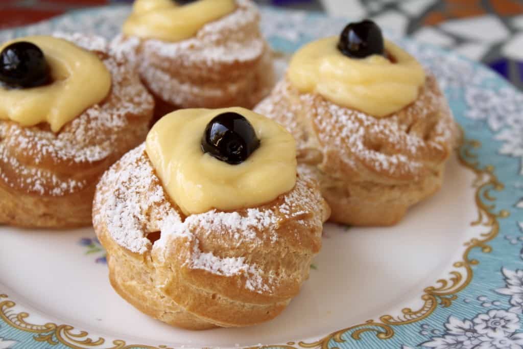 zeppole di san giuseppe on a pretty plate