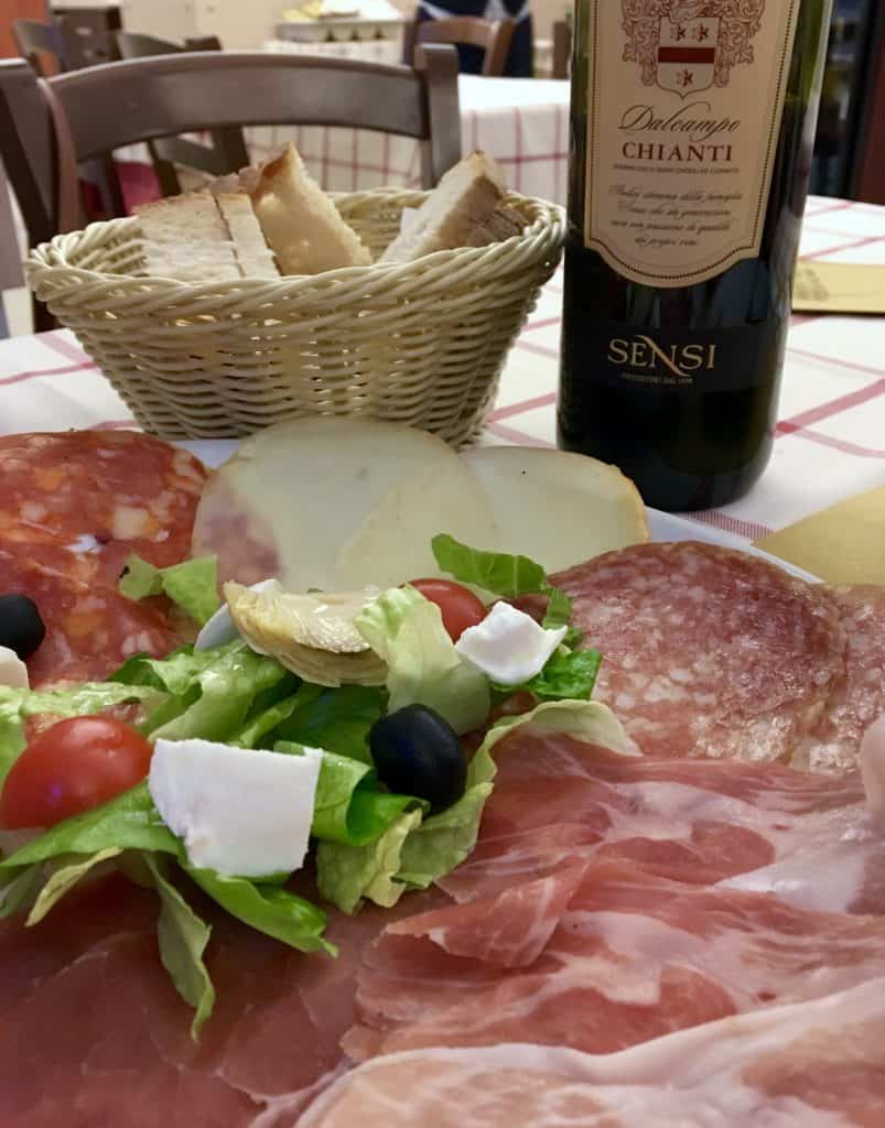 Antipasto, bread and wine in Rome.