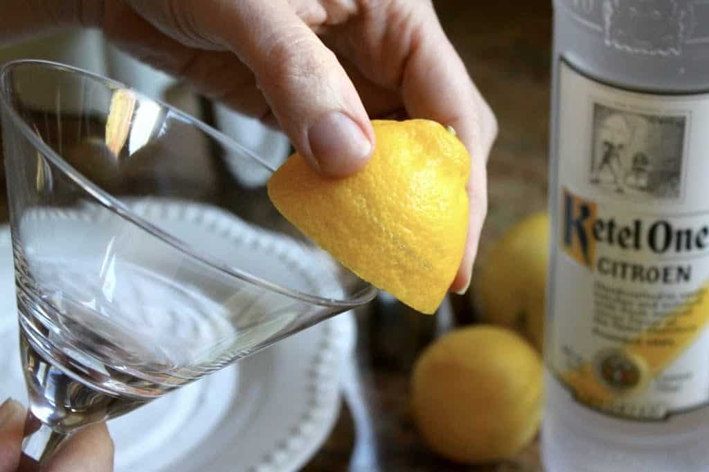 Rubbing glass with lemon to make Lemon Drop Martinis
