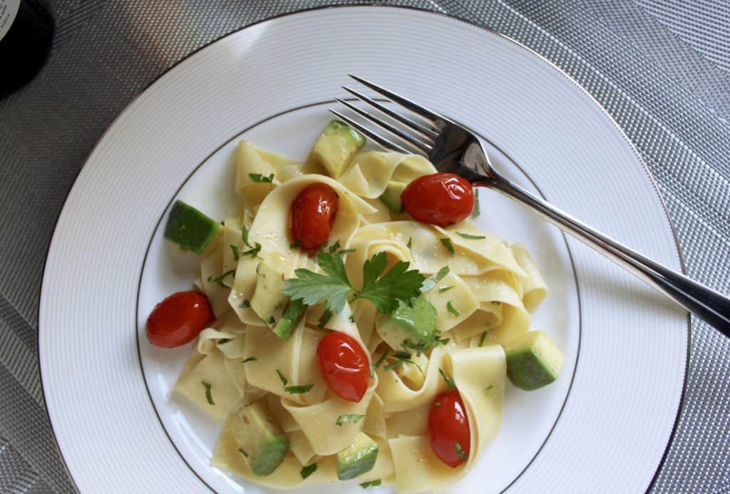 Egg pasta with avocado and cherry tomatoes