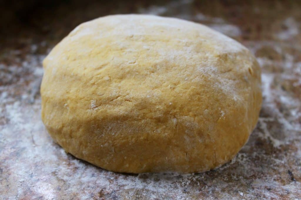 dough resting on a floured surface