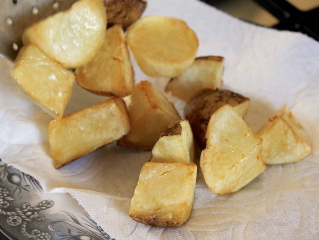 Frying potatoes for Patatas Bravas recipe