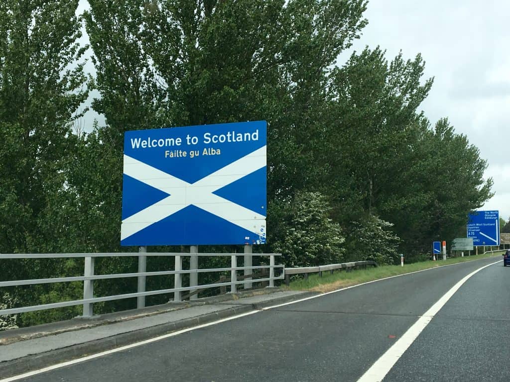 Welcome to Scotland sign driving a 500 mile castle tour of scotland